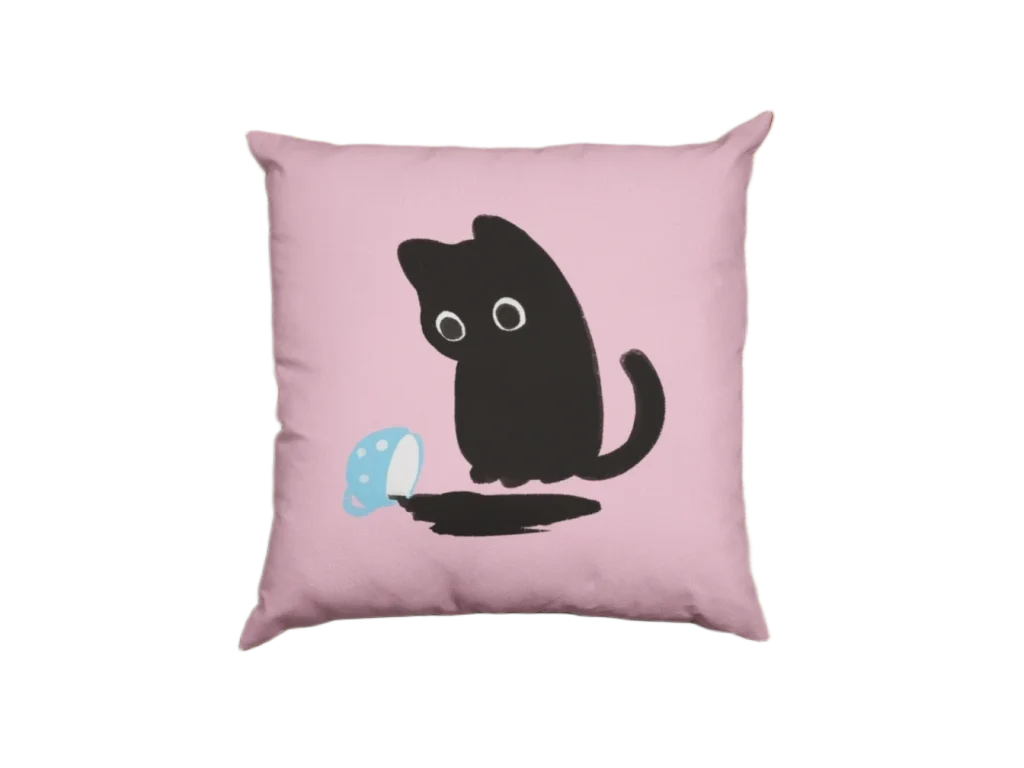 little cat watching coffee fall from a blue cup on a pink pillowcase
